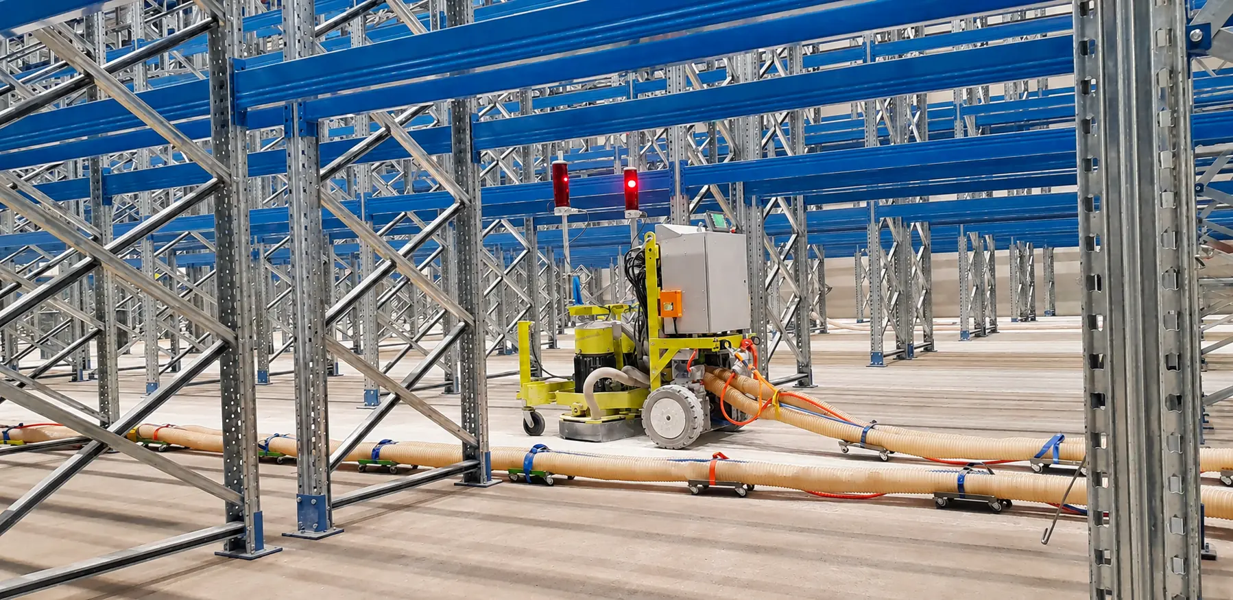 GM22 grinding robot in a high-bay warehouse